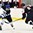 GRAND FORKS, NORTH DAKOTA - APRIL 16: Finland's Eeli Tolvanen #20 and Slovakia's Martin Fehervary #6 battle for the puck during preliminary round action at the 2016 IIHF Ice Hockey U18 World Championship. (Photo by Matt Zambonin/HHOF-IIHF Images)

